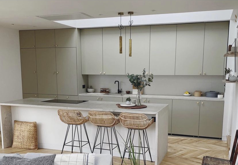 Olive grey handleless kitchen with island and rattan stools Yorkshire
