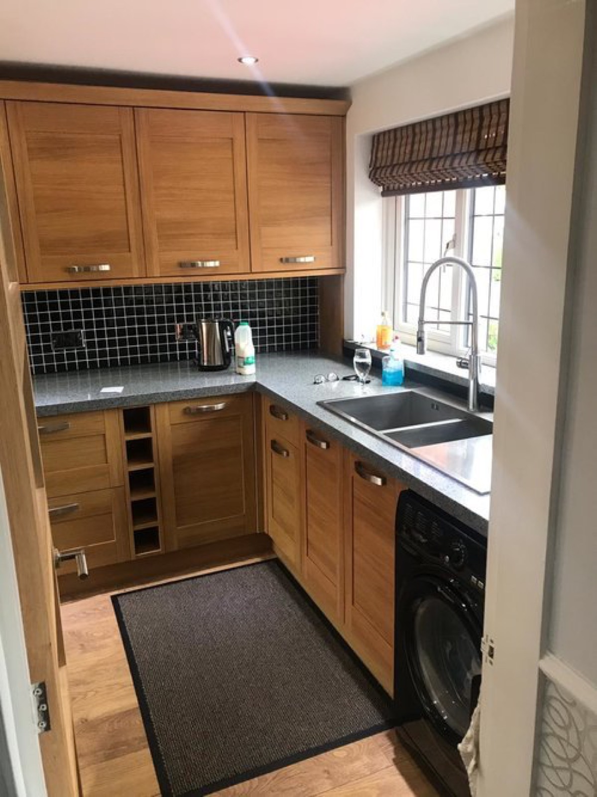 Oak-effect Shaker kitchen with grey worktops before respraying