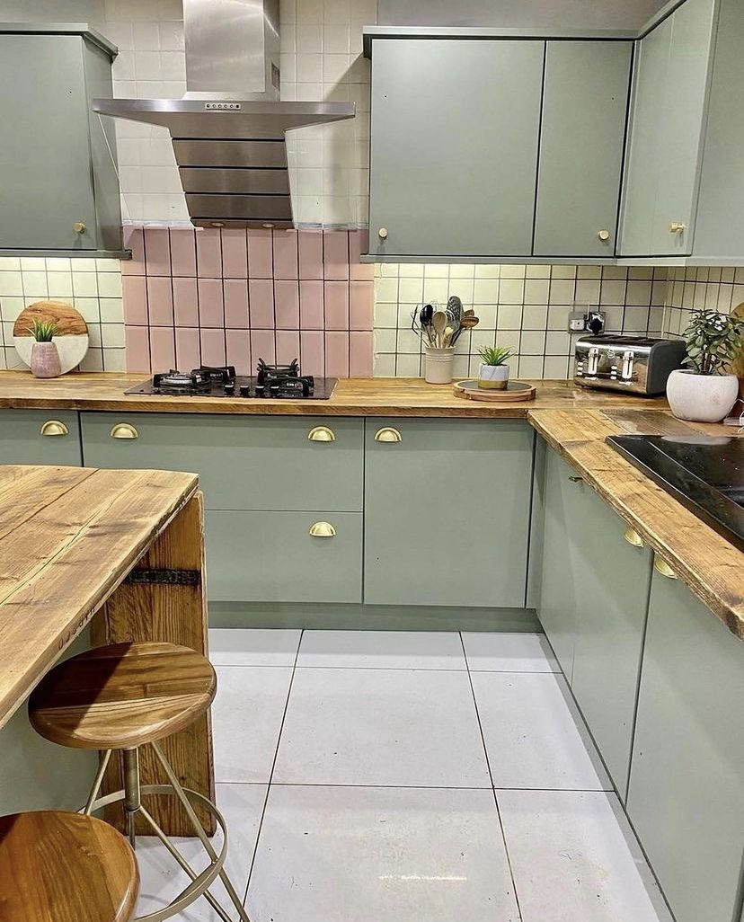 Sage green kitchen with brass cup handles and wood worktops Yorkshire