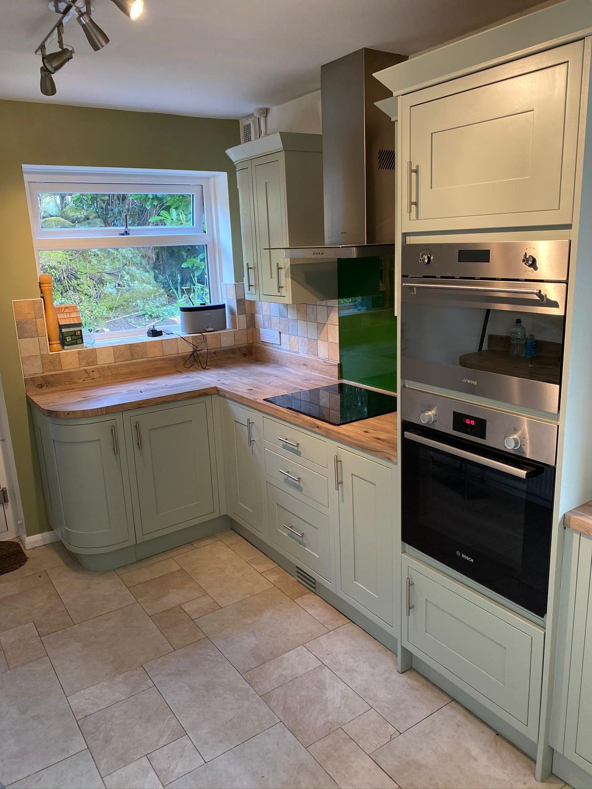 Sage green shaker kitchen with wood worktops Yorkshire